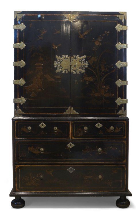 A Queen Anne black japanned cabinet on chest