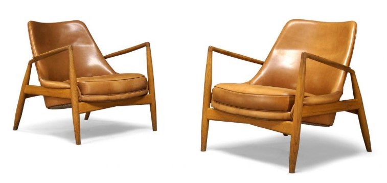 After Ib Kofod-Larsen (Danish 1921-2003), a pair of ‘Seal’ lounge chairs produced by Brdr Petersons Polstermobelfabrik c.2010